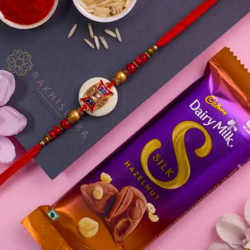 Charming Kundan Rakhi N Cadbury Silk Hazelnut Combo