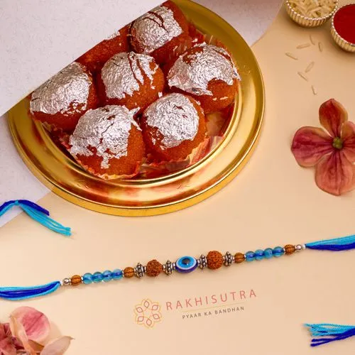 Sacred Evil Eye Rakhi  N  Ghee Laddu Festival Combo